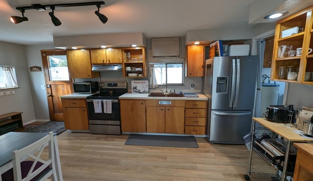 Spacious bungalow-style house with veranda, yard, and full amenities