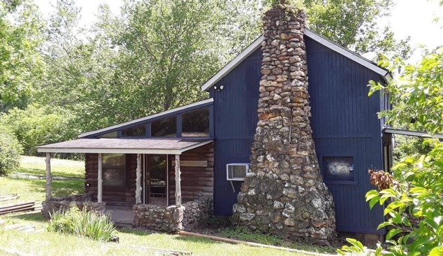 Spacious but cozy farmstead lodge has stone fireplace and sleeping for 9 to 10