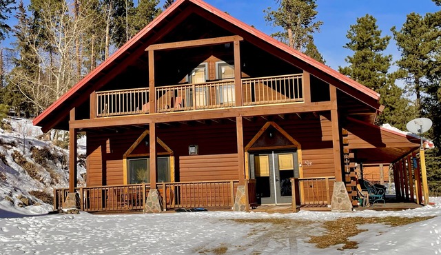Spacious cabin off Hwy 85 with beautiful views and plenty of trailer parking.