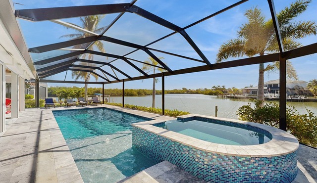 Spacious canal front home with private pool, dock & close to everything