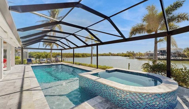 Spacious canal front home with private pool, dock & close to everything