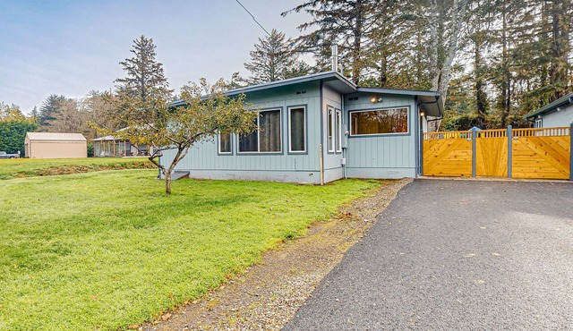 Spacious coastal property with separate living quarters, wood stove, & grill