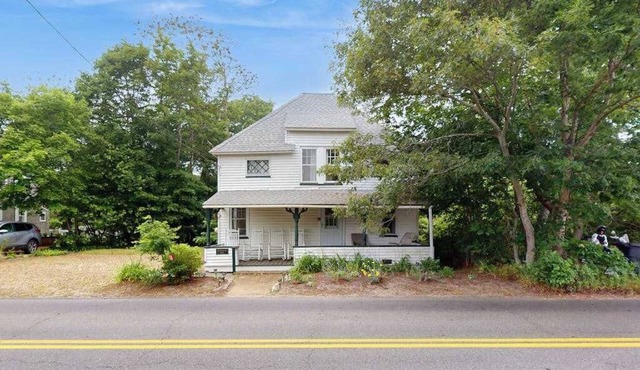 Spacious colonial home close to town with AC, porches, & W/D