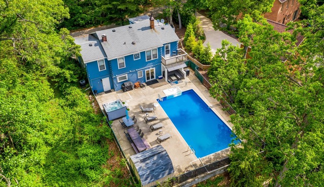 Spacious, dog-friendly home with a gas fireplace, pool, hot tub, & golf carts