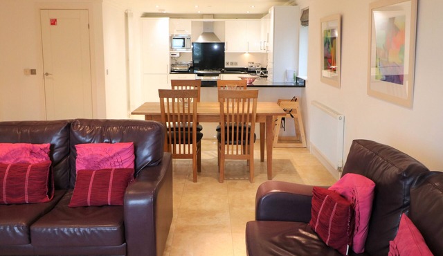 Spacious dog friendly apartment by the beach, private garden and sea views.