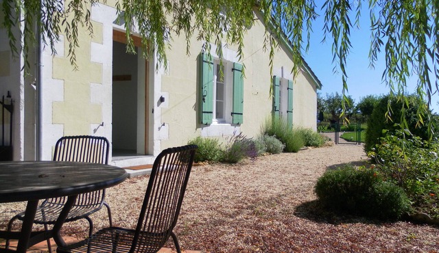 Spacious, double height, beamed main space. This gite is in a rural setting.