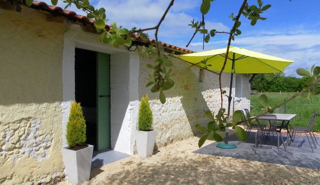 Spacious, double height, beamed main space. This gite is in a rural setting.