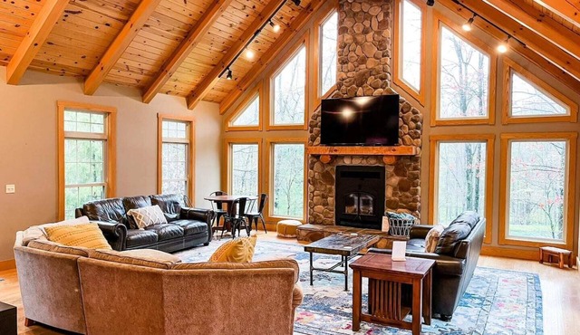Spacious, family-friendly lodge on 10 wooded acres. Sleeps 20 with 5 bedrooms, stocked pond