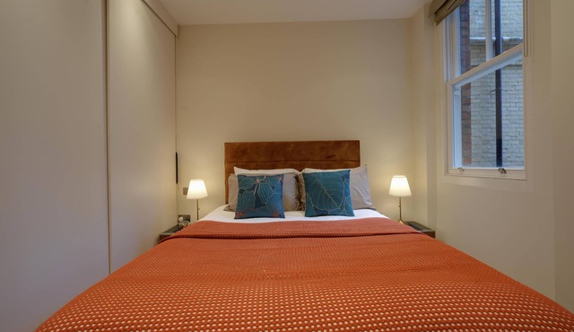 Spacious first-floor apartment with lift access on Great Titchfield Street. Sleeps 18 with 3 bedrooms, 3 living rooms, 3 kitchens, and 3 bathrooms. Steps from Oxford Street and Soho.