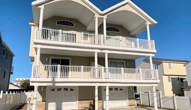Spacious front decks boast both ocean and bay views