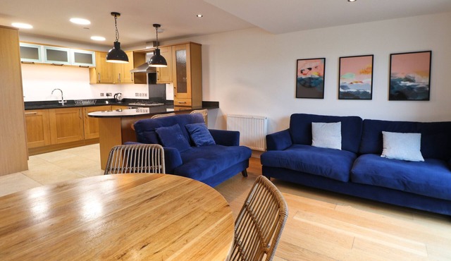 Spacious ground floor apartment with patio garden, just metres from the beach.