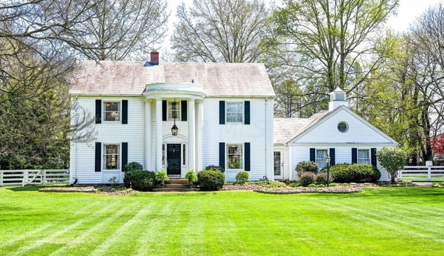 Spacious historic Colonial Manor with sprawling manicured lawns & mature trees.