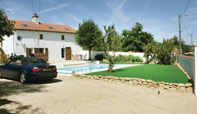 Spacious holiday home with heated swimming pool and outside space.