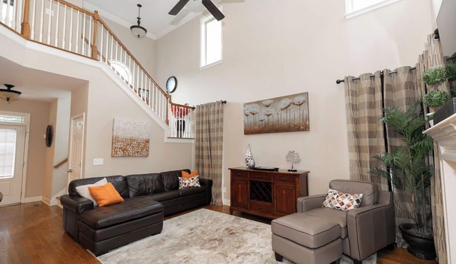 Spacious home with cozy bedrooms, basement lounge, screened porch, and full kitchen. Minutes from Mercedes-Benz Stadium, Six Flags, and downtown. Comfort, space, and a prime location—book now!