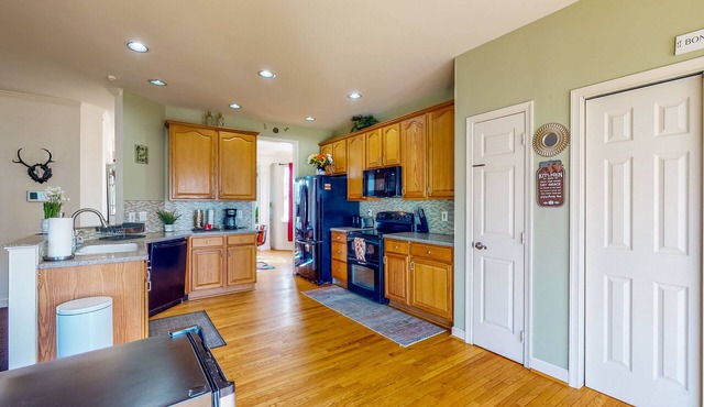 Spacious home with enclosed yard, deck, children's items, full kitchen, & W/D