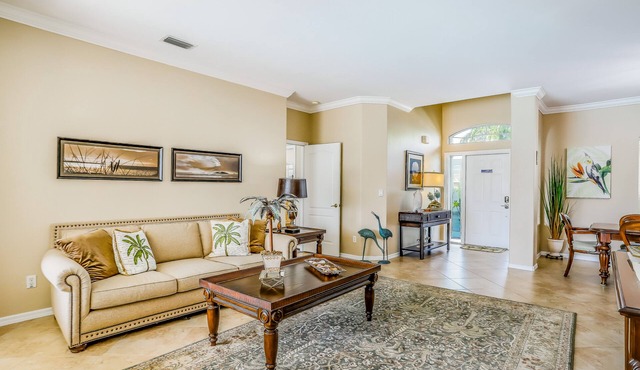 Spacious home with screened-in pool & lush lakefront views - minutes to beaches