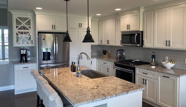 Spacious home with wet bar, air hockey & walkout basement to huge yard