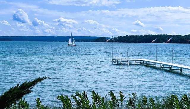 Spacious house on Lake Leelanau with sandy beach and dock.