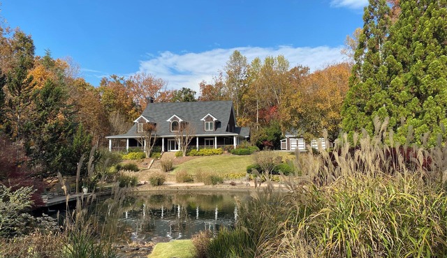 Spacious Lake Front Home with beautiful Gardens, Pond, Waterfall, Pool, & Dock