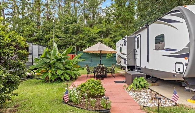 Spacious luxury RV with large kitchen/living room area, private bedroom w/king-size bed, bath and 1/2, with a deck, located in a beautiful RV resort with tons of amenities. Min. stay is 2 nights w/weekly and monthly discounts. Monthly rate is $1,600