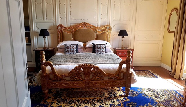 Spacious luxury Studio Room with king-size bed, and freestanding bath