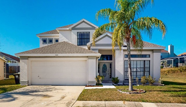 Spacious modern home with enclosed pool, patio, and gas grill