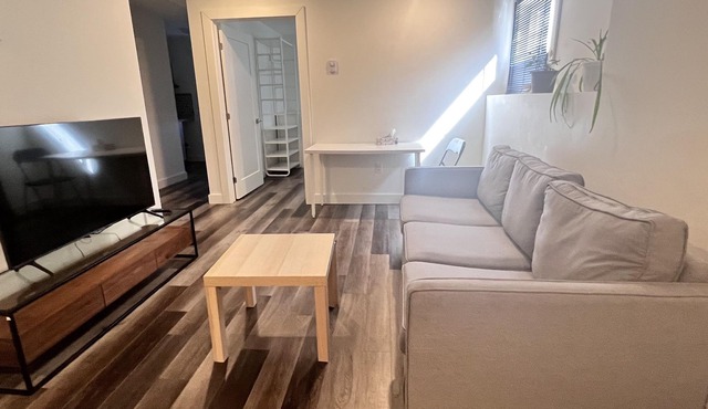 Spacious one bedroom basement apartment with 2 queen size beds &private entrance