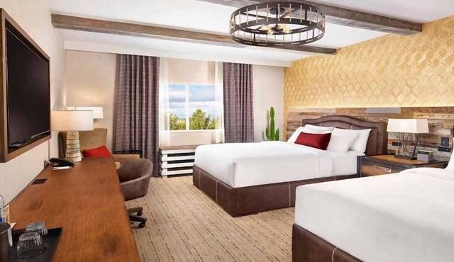 Spacious Room with Two Queen Beds and Stunning Poolside Views