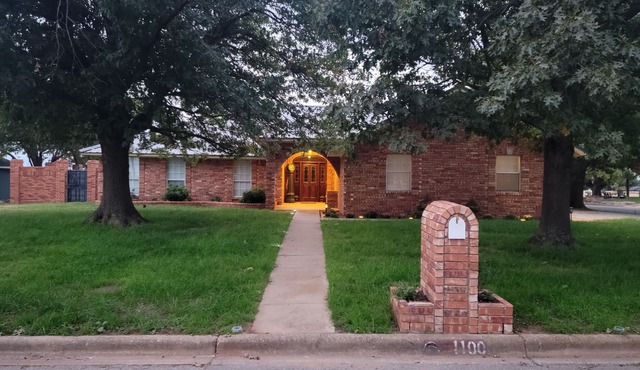 Spacious small town retreat with inground pool and privacy fence.