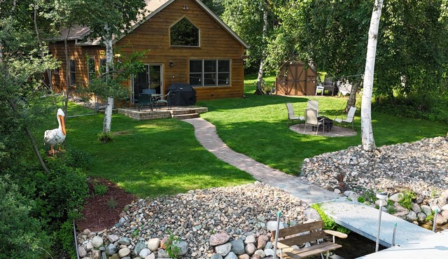 Spacious Summer Escape: Private Backyard, Dock & Fire Pit, Channel Waterfront
