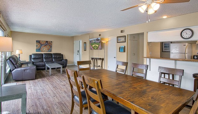 Spacious upstairs unit located just one house from the sand!