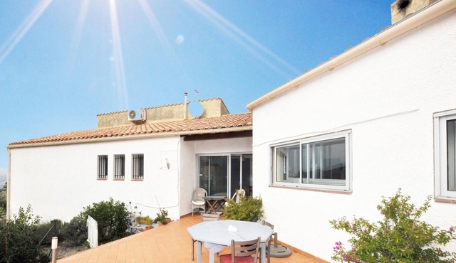Spacious vacation home with private outdoor pool and panoramic views of the mountains and the sea.