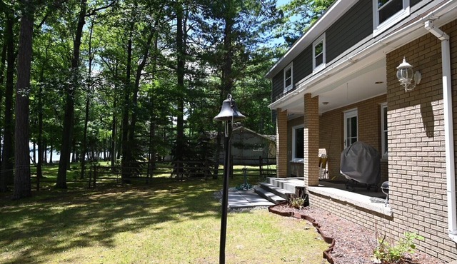 Spacious vacation home on large private wooded lot on crystal clear Hubbard Lake