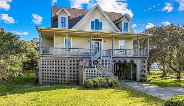 Spacious waterfront home with dock, outdoor shower, W/D, & fish-cleaning station