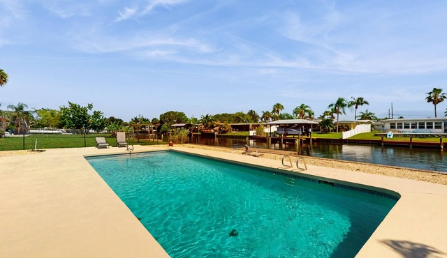 Spacious waterfront home with private pool, sunroom and dock.