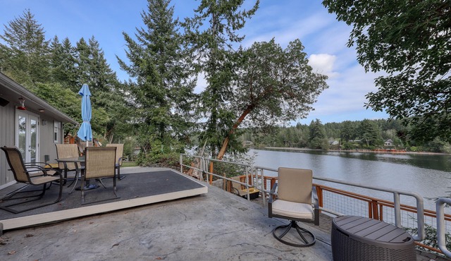 Spacious waterfront home with hot tub, large decks, kayaks, and beach access