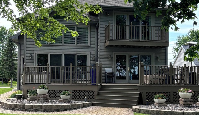 Spectacular, four-bedroom waterfront home near EAA grounds and airport.
