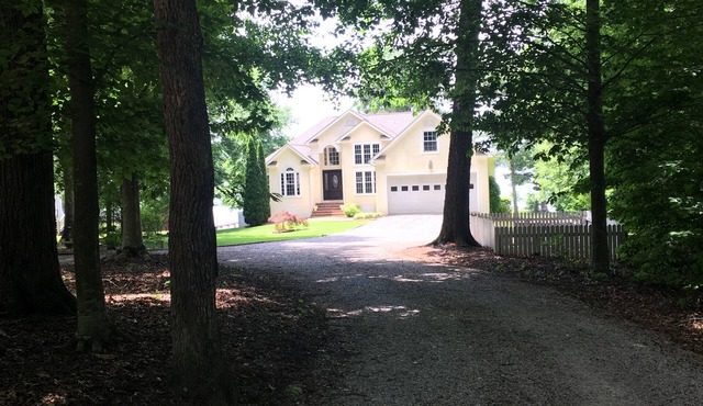 Spectacular Main Lake Sunsets from spacious 4 BR, 3800 sq ft, 1-acre point lot