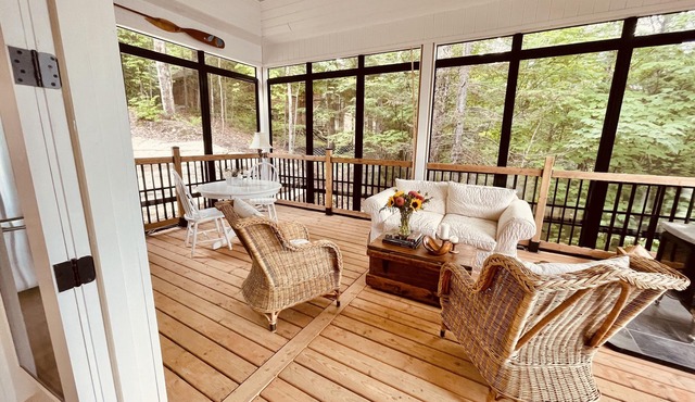 Spectacular new 4 season cottage on pristine Kennisis Lake! Sauna and hot tub!