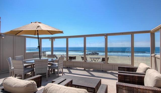 Spectacular oceanfront upper unit with amazing views from awesome roof top deck!