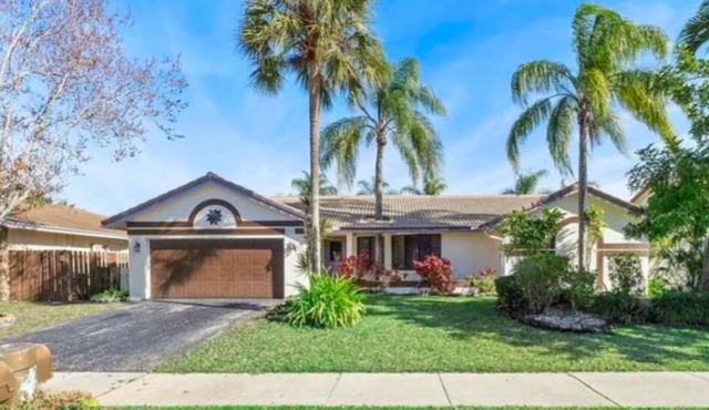 Spectacular stylish 4-bedroom home with pool, large screened patio, lake view.