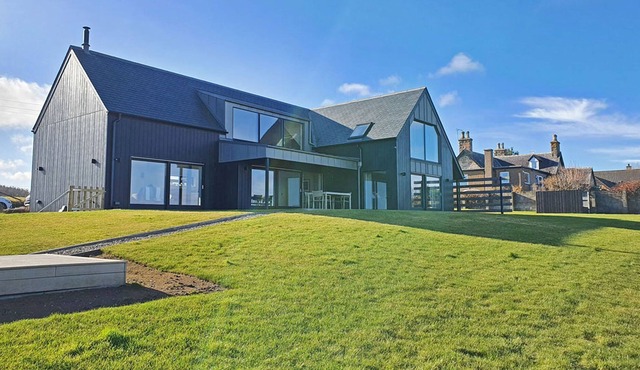 Spectacular uninterrupted views of Loch Fleet and the countryside from every room