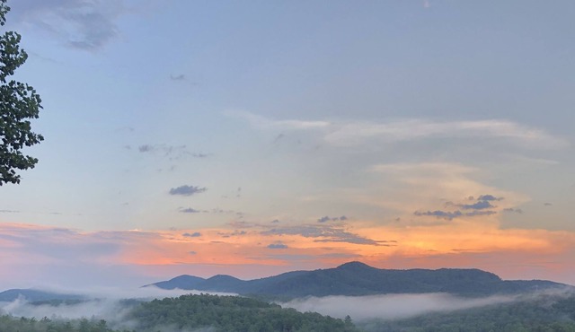 Spectacular view of a gorgeous mountain valley and golf course awaits you