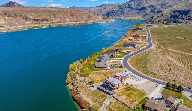 Spectacular waterfront home with two decks, hot tub, fireplace, & small beach