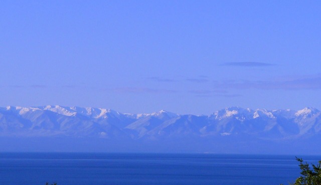 Spectacular West side views of Strait, Olympics, Victoria, south to Mt Rainier.n