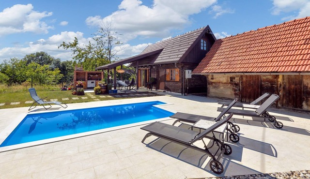 Spend a carefree vacation in this modern furnished vacation home with pool.