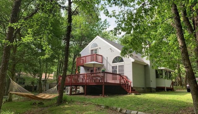 Spend Memorial Day in the Poconos. Barbecue in this lovely chalet on large deck
