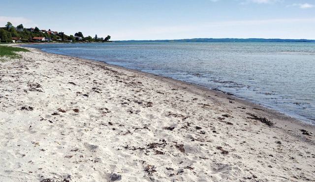 Spend your vacation near Aarhus and at the same time only a short walk from the beach.