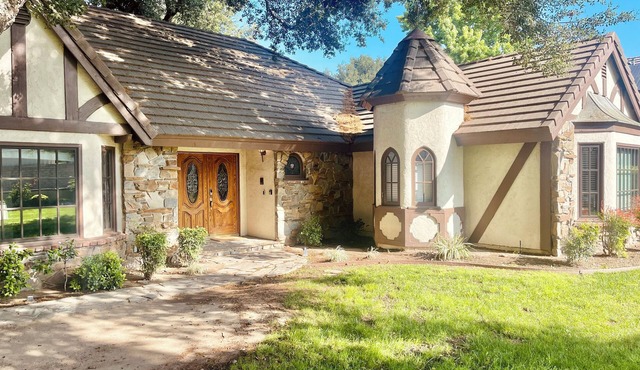 Sprawling 4-Bedroom Tudor Retreat with Spacious Backyard Oasis