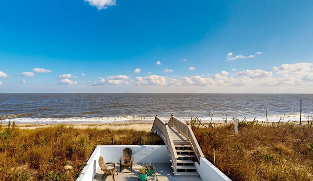 Sprawling beachfront home with alfresco dining, grill, games, W/D, & open layout